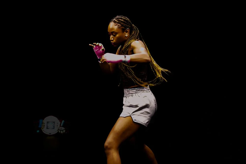 Athletic portrait against a black background