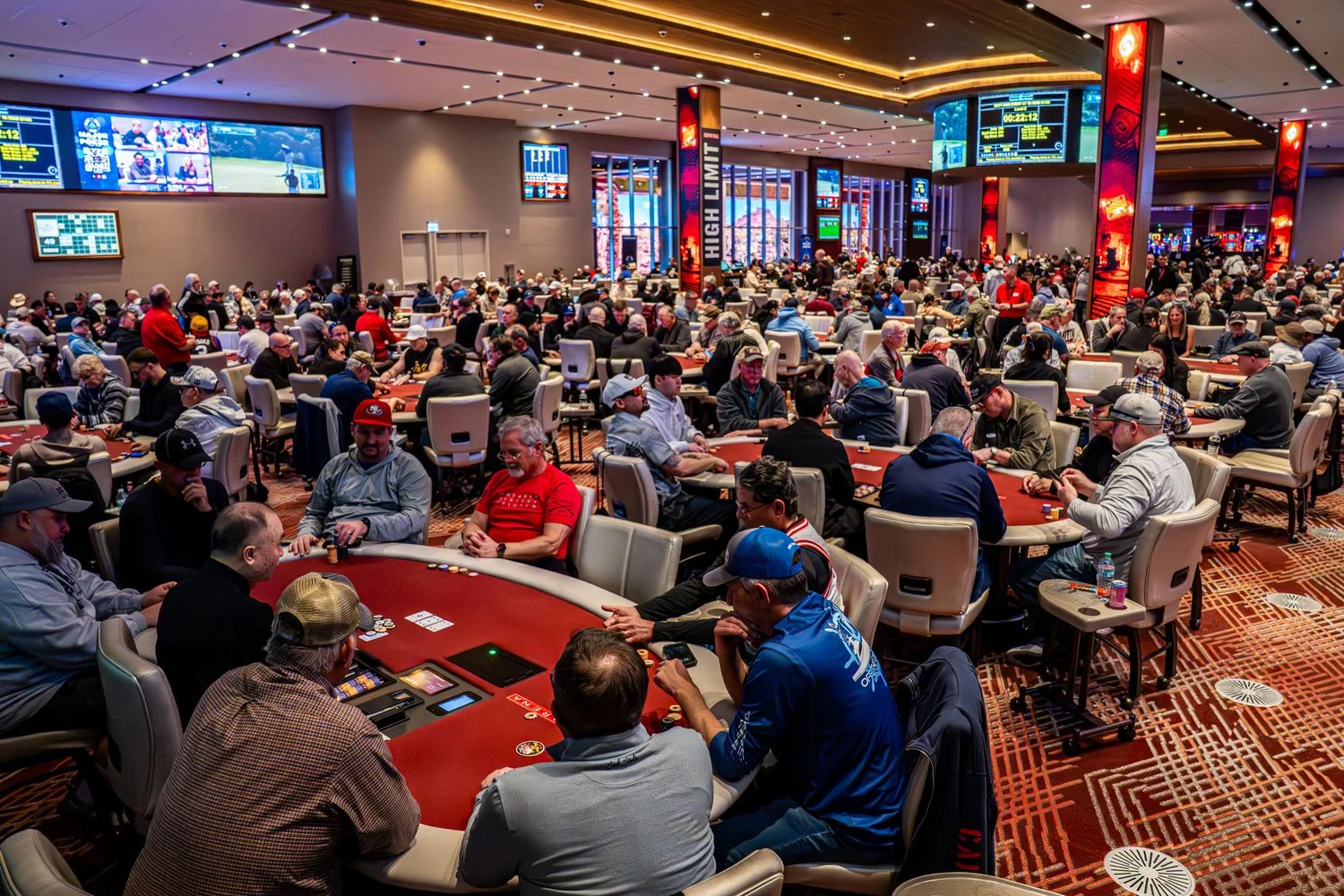 Poker tournament room filled with players and tables