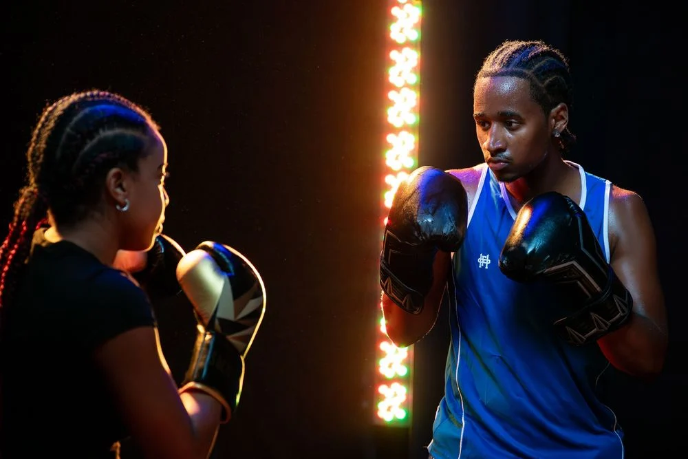 Boxing portrait under colorful studio lighting