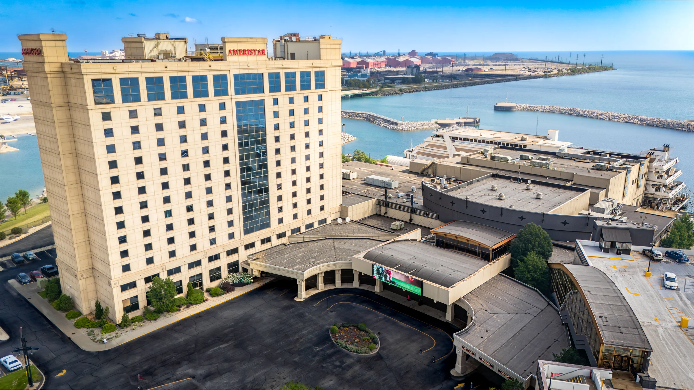 Aerial view of the Ameristar hotel and casino complex beside a waterfront marina.