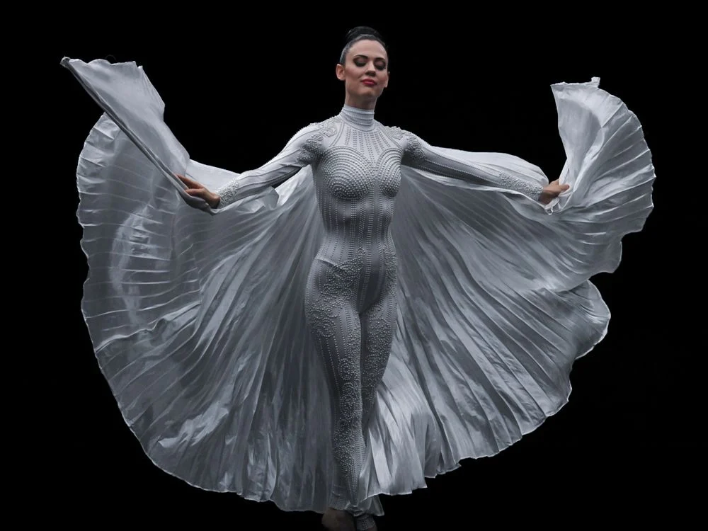 Studio portrait of a performer against black