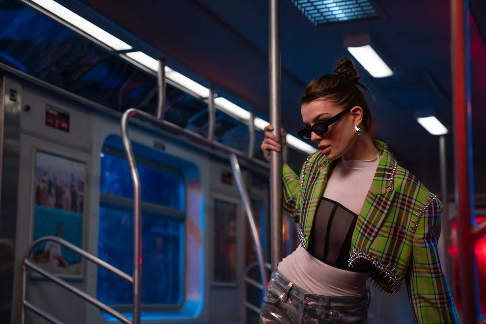 Editorial fashion portrait inside a subway car