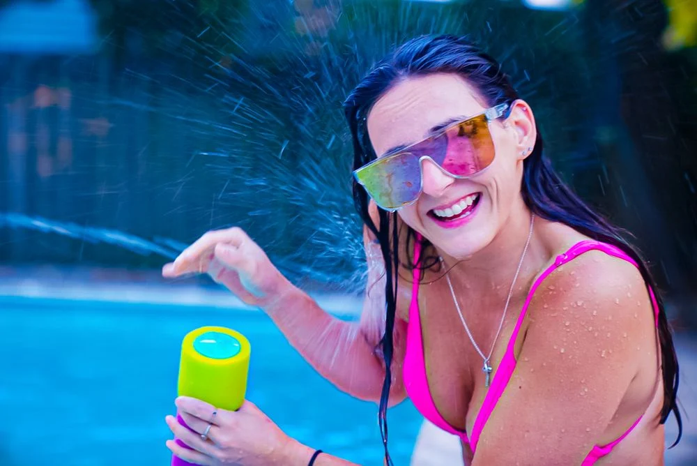 Bright candid portrait beside a swimming pool