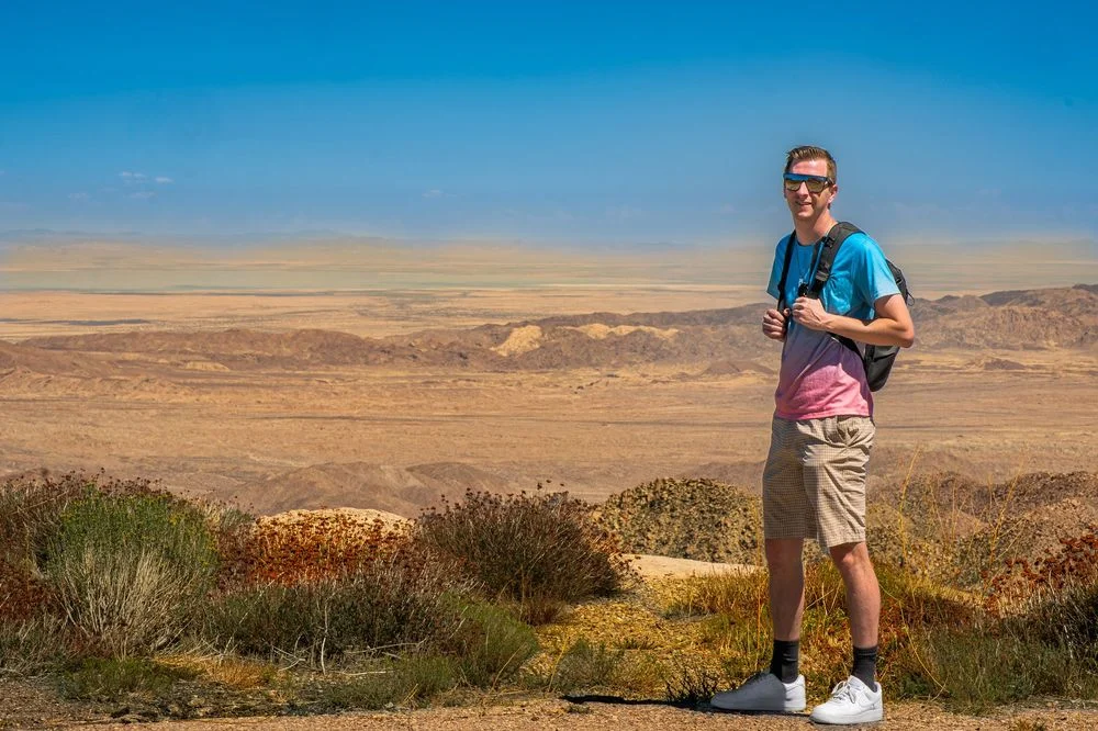 Travel portrait overlooking a desert landscape