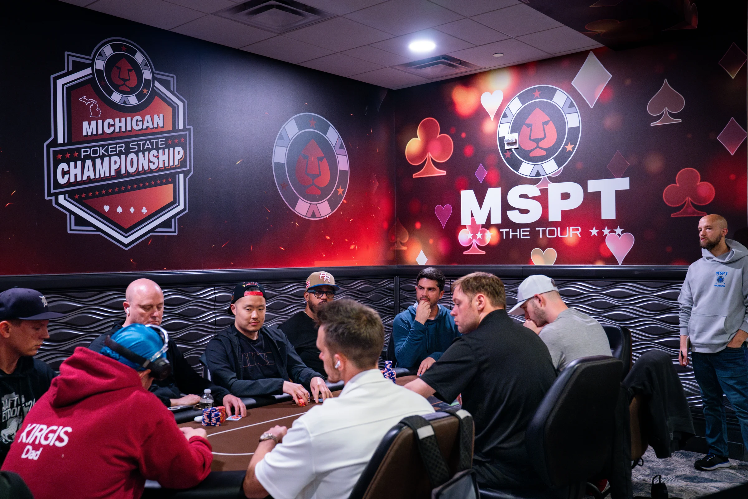 Poker players compete beneath Michigan Poker State Championship and MSPT wall graphics.